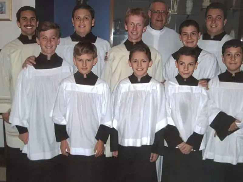 A group of people in choir robes posing for a picture.