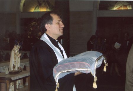 A man holding a bag of food in his hands.