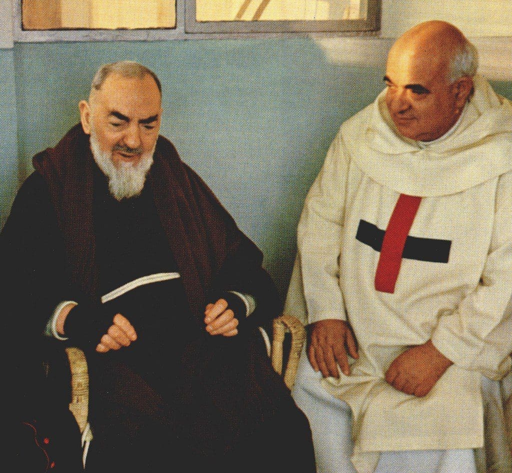 Two men seated, engaged in conversation.