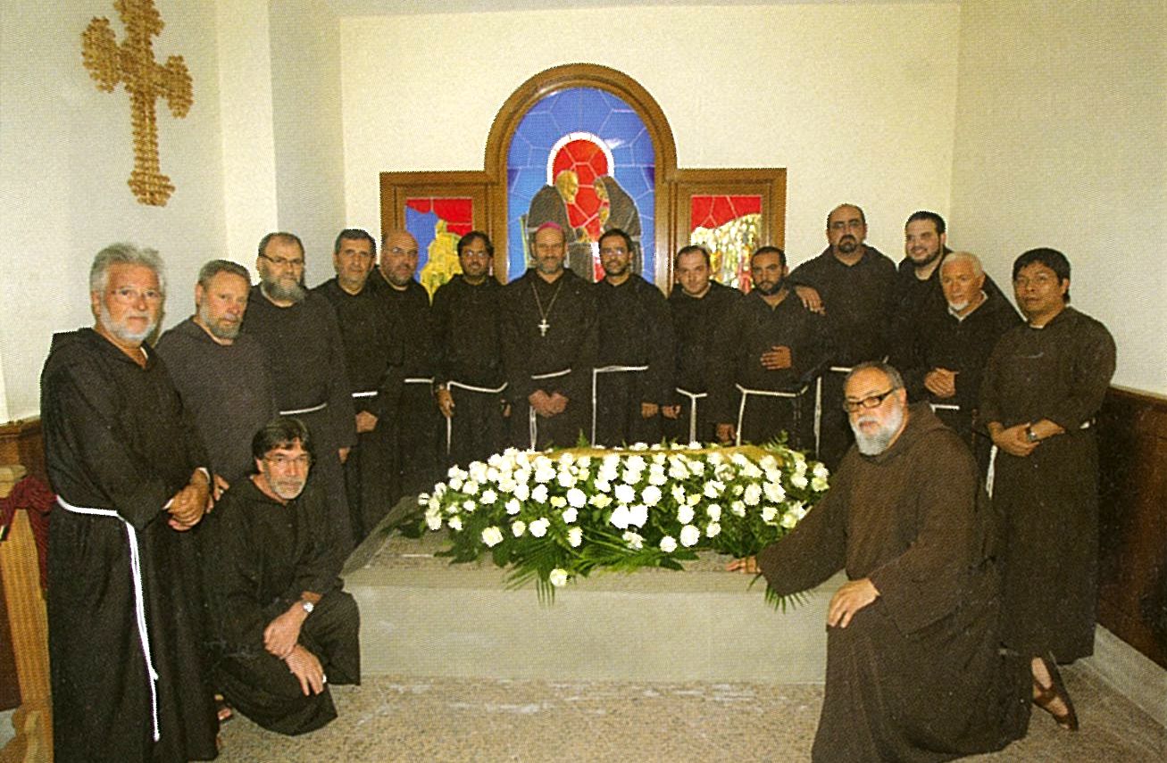 A group of men in black robes and hats.