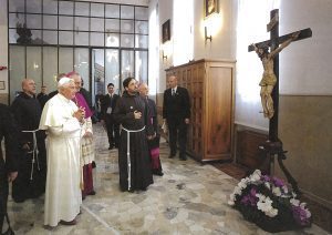 Pope Benedict XVI gazes at the wooden crucifix in the chapel of OUr Lady of Grace in San Giovanni Rotindo. Padre Pio was praying in front of this crucifix when he received the wounds of Christ, the stigmata.