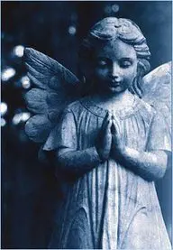 A statue of an angel with hands in prayer.