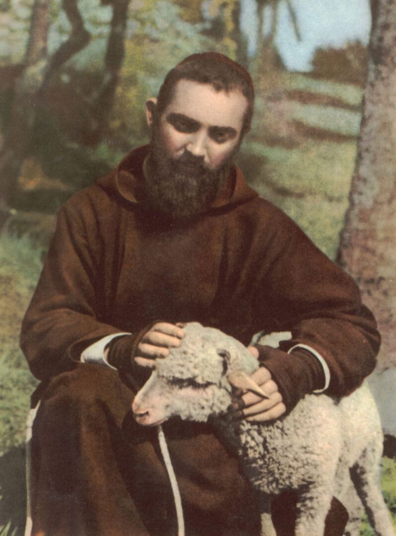 A man in brown robe holding sheep with one arm.