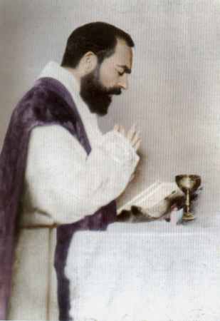A man in purple robe holding hands with a cup.