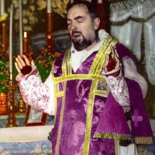 A man in purple and yellow outfit holding his hands out.