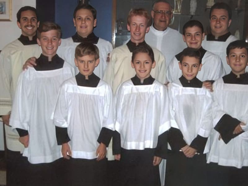 A group of people in choir robes posing for a picture.