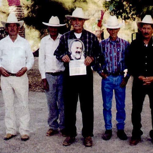 A group of men standing next to each other.
