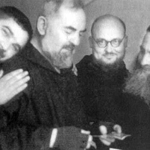 A group of men standing next to each other.
