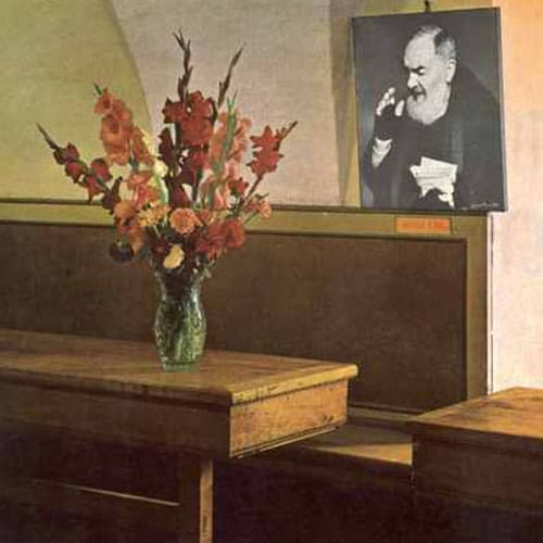 A painting of flowers in a vase on the table