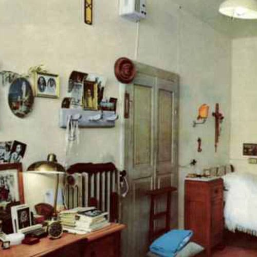 A room with many pictures on the wall