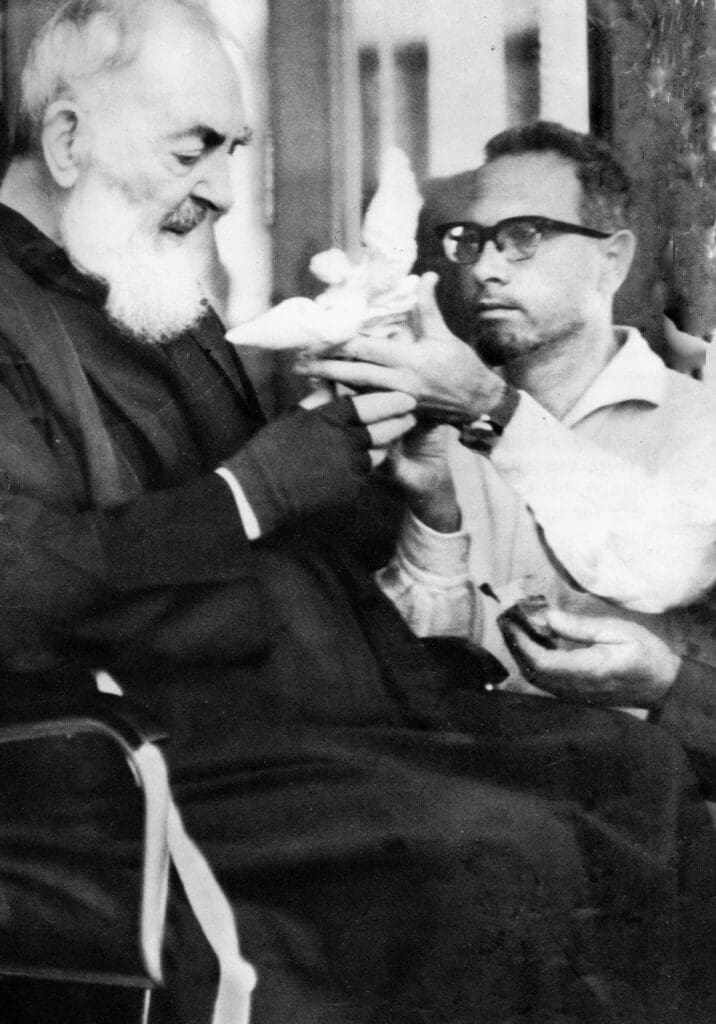 Two men interacting with a white dove.