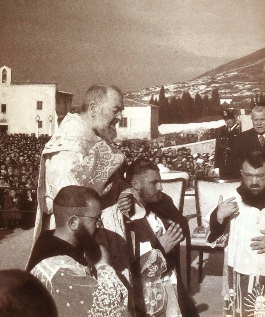 Priests in a religious outdoor ceremony gathering.