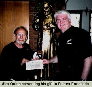 Two men with statue and a document.
