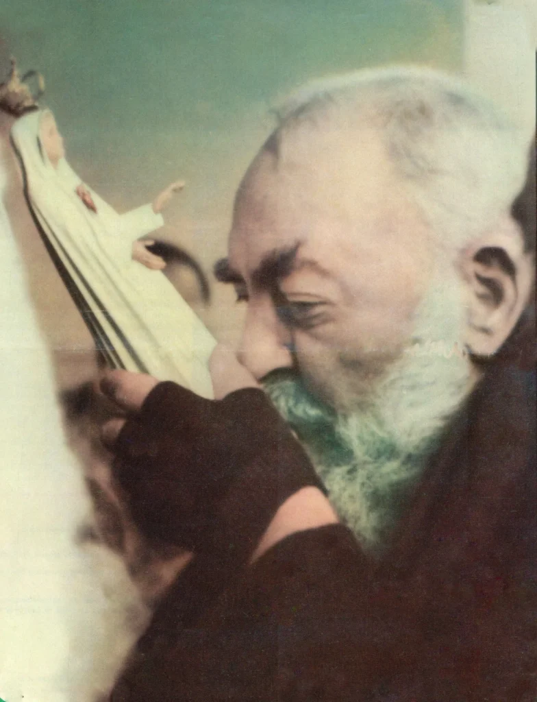Elderly bearded man kissing religious statue